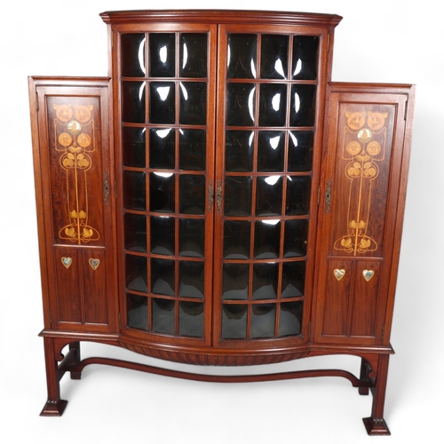 124 - Shapland & Petter, an Art Nouveau mahogany display cabinet, 2 central doors with bow-glass panels (1... 