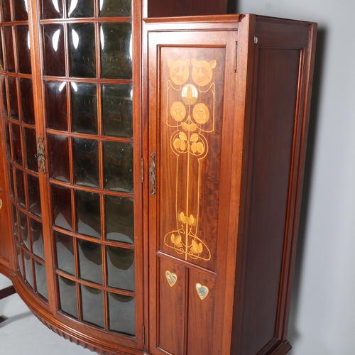 124 - Shapland & Petter, an Art Nouveau mahogany display cabinet, 2 central doors with bow-glass panels (1... 