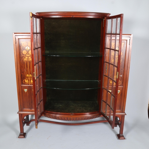 124 - Shapland & Petter, an Art Nouveau mahogany display cabinet, 2 central doors with bow-glass panels (1... 