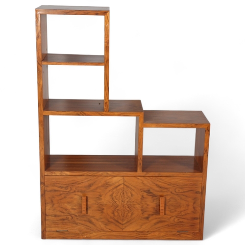 129 - Art Deco walnut stepped open bookcase with drop-front cupboard below, width 77cm, height 107cm