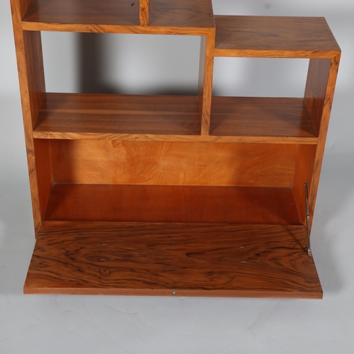 129 - Art Deco walnut stepped open bookcase with drop-front cupboard below, width 77cm, height 107cm