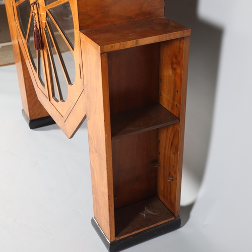 138 - An Art Deco Octagonal shaped display cabinet,  walnut veneer cabinet on ebonised feet, with shelves ... 