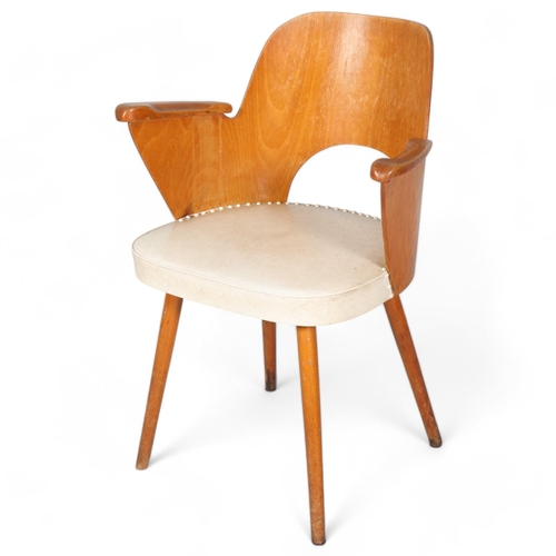 263 - A mid 20th century Thonet desk chair, bent beech plywood frame with beech pin legs and beech armrest... 