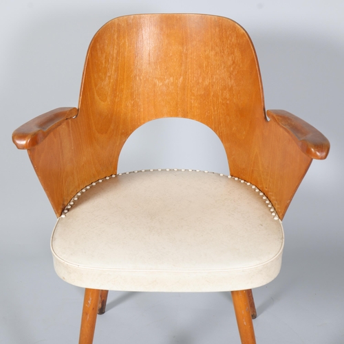 263 - A mid 20th century Thonet desk chair, bent beech plywood frame with beech pin legs and beech armrest... 