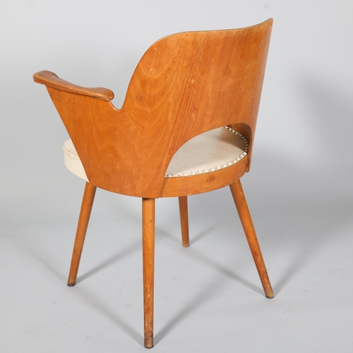 263 - A mid 20th century Thonet desk chair, bent beech plywood frame with beech pin legs and beech armrest... 