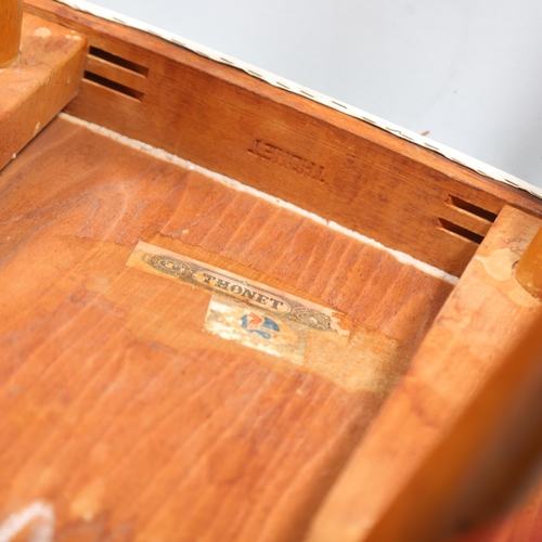 263 - A mid 20th century Thonet desk chair, bent beech plywood frame with beech pin legs and beech armrest... 