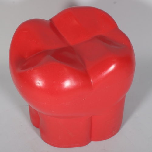 265 - A red plastic stool in the form of a molar or tooth, possibly from a dentist’s waiting room, with mo... 