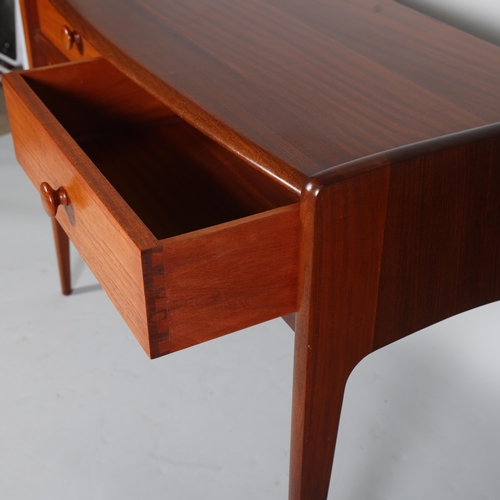 326 - JOHN HERBERT for A Younger Ltd, a teak console table or desk with two drawers, makers label to back ... 