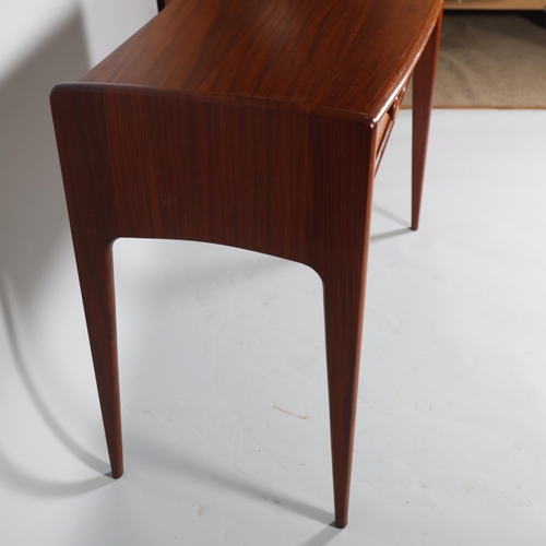 326 - JOHN HERBERT for A Younger Ltd, a teak console table or desk with two drawers, makers label to back ... 