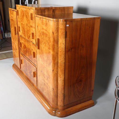 6 - Art Deco burr-walnut cocktail cabinet, circa 1920s, central cocktail fall-front with rising top encl... 