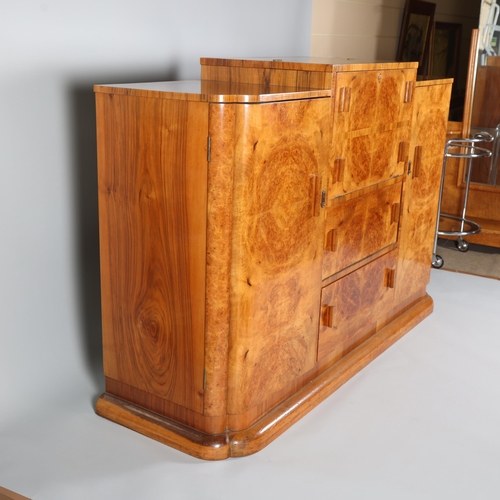 6 - Art Deco burr-walnut cocktail cabinet, circa 1920s, central cocktail fall-front with rising top encl... 