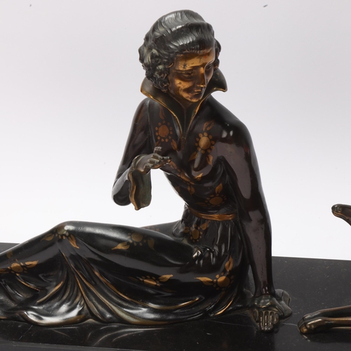 17 - Art Deco gilded and patinated spelter figure of a woman with a fawn, on black marble base, unsigned,... 