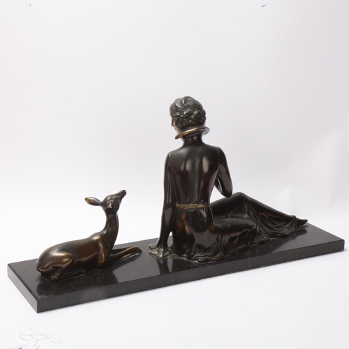 17 - Art Deco gilded and patinated spelter figure of a woman with a fawn, on black marble base, unsigned,... 