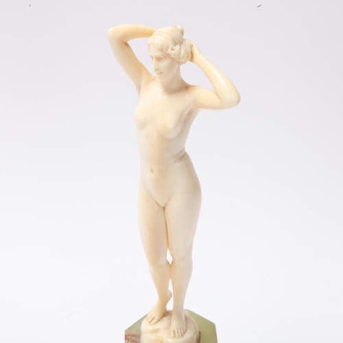 28 - Art Nouveau simulated ivory Classical nude on onyx base, unsigned, height 18cm