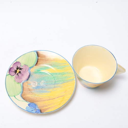 55 - Clarice Cliff Delicia Pansies cup and saucer, saucer diameter 14.5cm