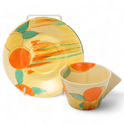 76 - Clarice Cliff Bizarre Delicia Peaches pattern cup and saucer, saucer diameter 15cm