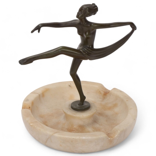 92 - Art Deco bronze patinated spelter and alabaster ashtray surmounted by an erotic dancer, height 16cm