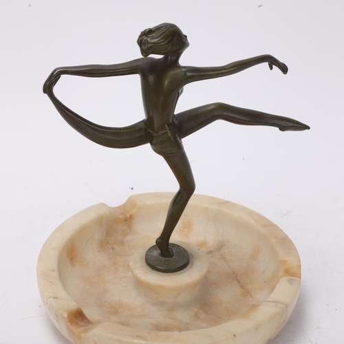 92 - Art Deco bronze patinated spelter and alabaster ashtray surmounted by an erotic dancer, height 16cm