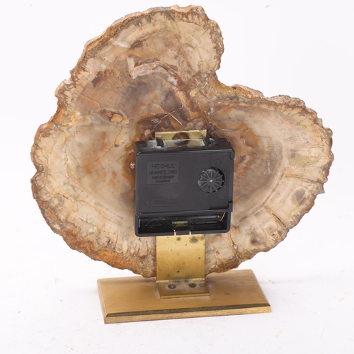 256 - A mid 20th century quartz clock, with a fossilised wood face on brass stand, no makers mark, height ... 