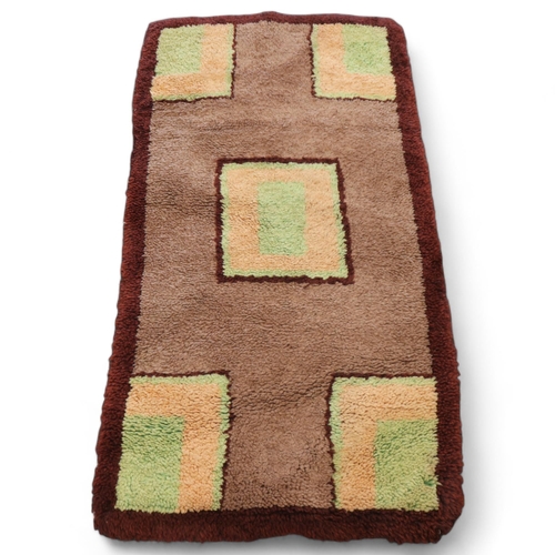 317 - A 1930s Art Deco modernist hand tufted rug, 130 x 70cm