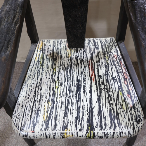 332 - TERRY WARREN, a hand made ebonised driftwood armchair, with marble painted seat and painted insert p... 