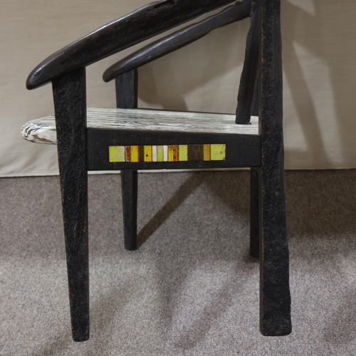 332 - TERRY WARREN, a hand made ebonised driftwood armchair, with marble painted seat and painted insert p... 