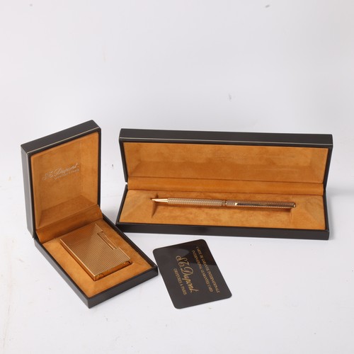 648 - SJ Dupont, a 1980s' gold plated lighter and Ballpoint pen, with original fitted boxes and guarantee ... 