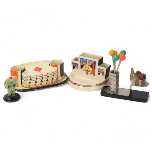 90 - A group of Art Deco novelty items, comprising Royal Doulton Bridge set on stand, Bakelite Bridge mar... 