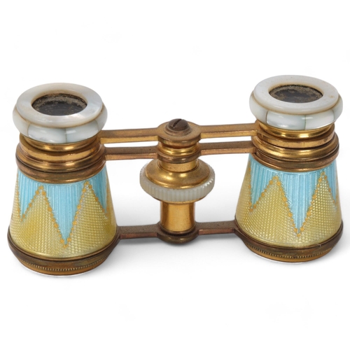 864 - A pair of 19th century French opera glasses, gilt-brass with coloured enamel and mother-of-pearl, wi... 