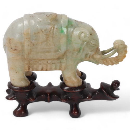 865 - A pair of small Chinese carved jade elephants on carved wood stands, length 10.5cm