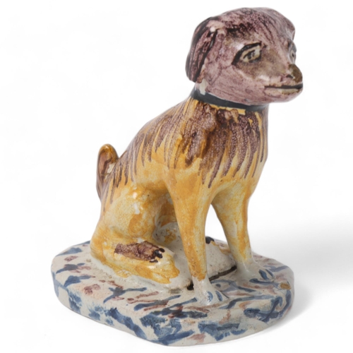 866 - A 19th century Delft pottery dog, height 8.5cm