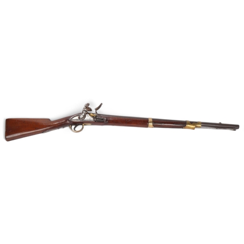 893 - An antique flintlock rifle, with brass bound barrel, makers stamp to barrel, stock marks AM and crow... 