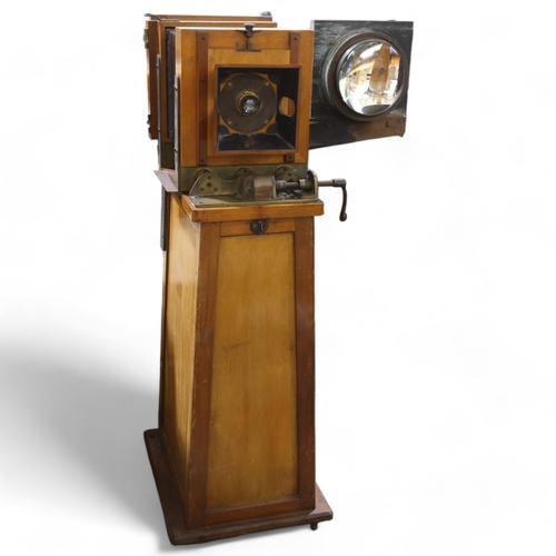 718 - A large Victorian floor standing studio camera, mahogany and brass, with inter-changeable plate size... 