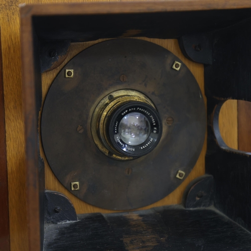 718 - A large Victorian floor standing studio camera, mahogany and brass, with inter-changeable plate size... 