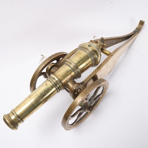 735 - A good quality brass table cannon, 18th or 19th century with ringed barrel on wheeled carriage, barr... 