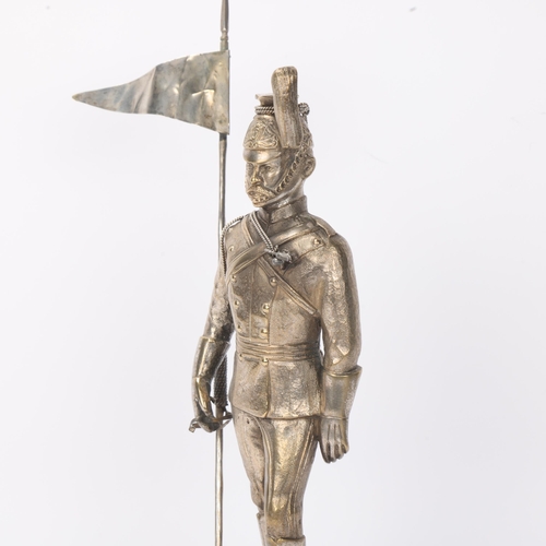 736 - A 19th century electroplate figure of a Standard Bearer from the 12th Lancers, ebonised base with mi... 