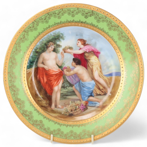 740 - A Vienna porcelain plate depicting 3 Classical figures, gilded border, diameter 24cm