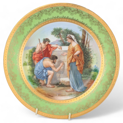 744 - A Vienna porcelain plate depicting 3 Classical figures, gilded border, diameter 24cm