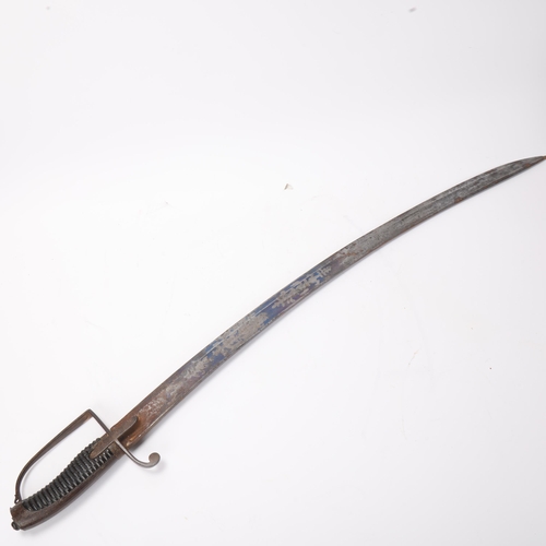 750 - A Georgian military Cavalry sabre, carved wood grips with partly blued blade and Royal cipher, lengt... 