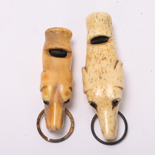 756 - 2 x 19th century carved bone dog-head design whistles, largest 7cm (2)