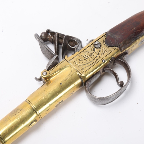 761 - An 18th century brass cannon barrel flintlock pistol, by Clarke of Cheapside London, serial no. 102,... 