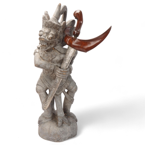 775 - A Malayan carved wood grotesque figure Kris stand, together with a Kris dagger in white metal scabba... 