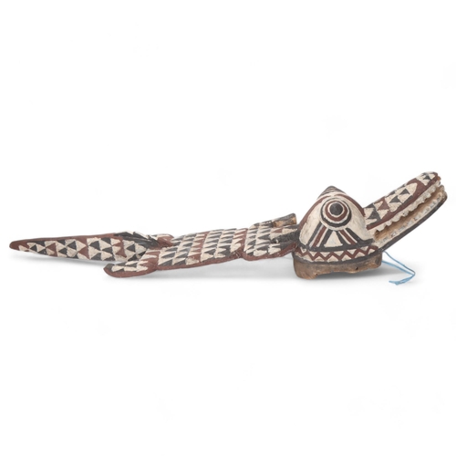 776 - An African carved and painted wood Tribal crocodile mask, length approx 115cm