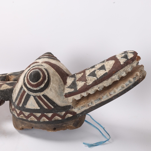 776 - An African carved and painted wood Tribal crocodile mask, length approx 115cm