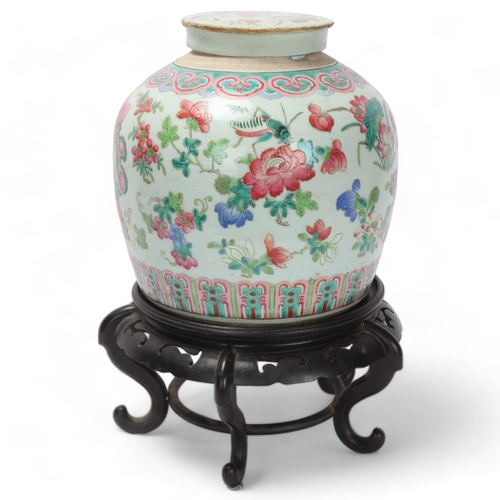 784 - A Chinese 19th century famille rose porcelain jar and cover, with painted enamel insects and flowers... 