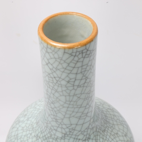 785 - A Chinese crackle glaze porcelain onion-shaped vase on carved wood stand, overall height 39cm