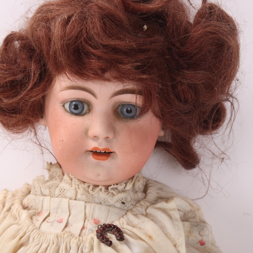 805 - A bisque porcelain-headed girl doll, by Simon & Halbig, with dimple chin, length 46cm