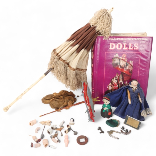 808 - A collection of doll related items, doll's house items, spare limbs, peg doll and a book, The Collec... 