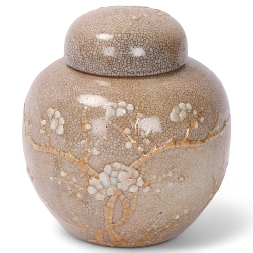 815 - A Chinese crackle glaze porcelain ginger jar and cover, with relief moulded blossom trees, height 13... 