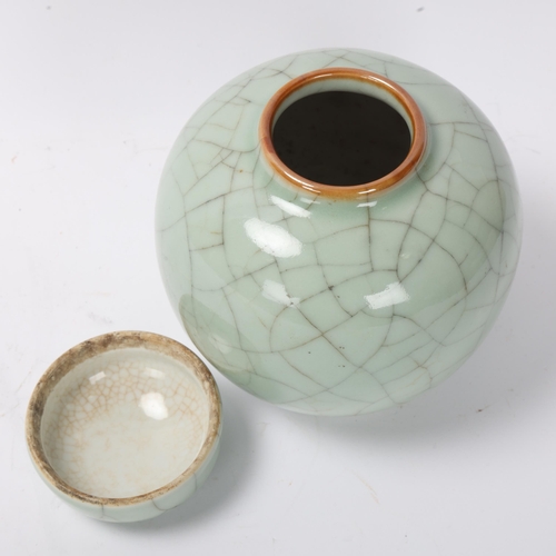 816 - A Chinese celadon crackle glaze porcelain ginger jar and cover, height 14cm